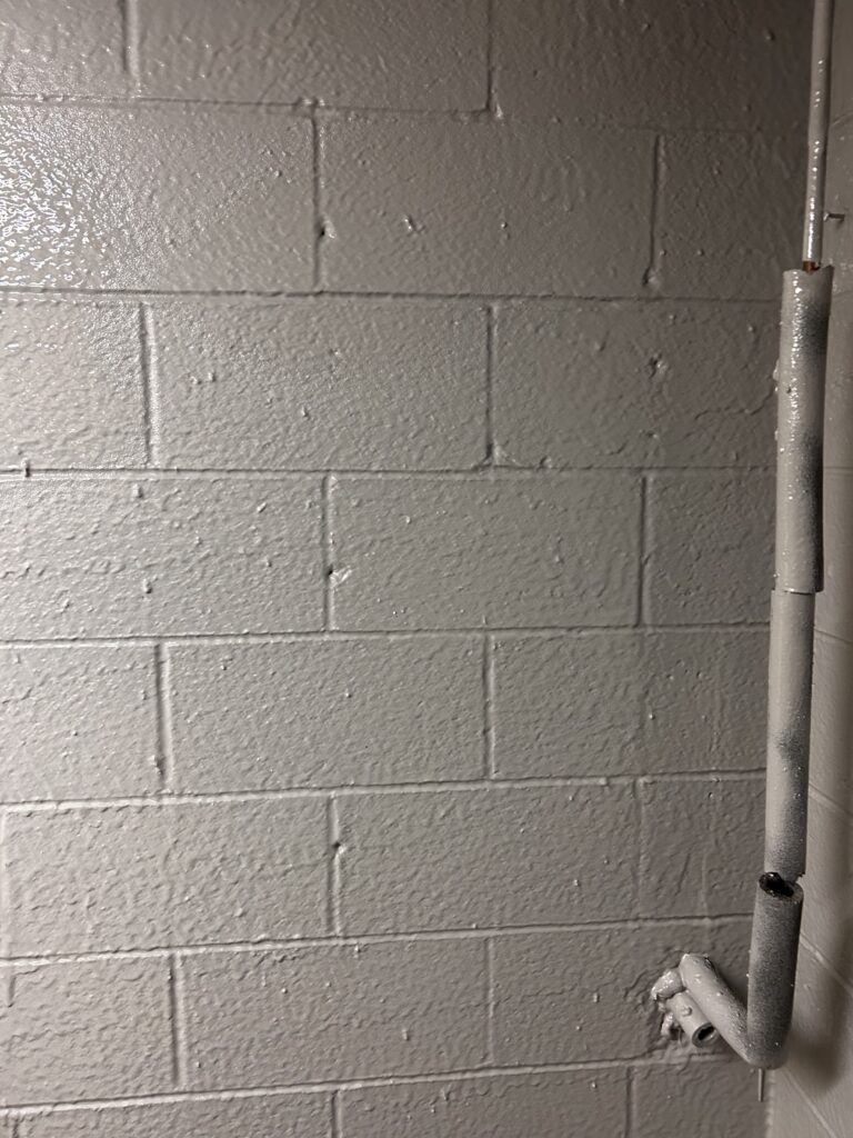 insulation on cinderblock wall